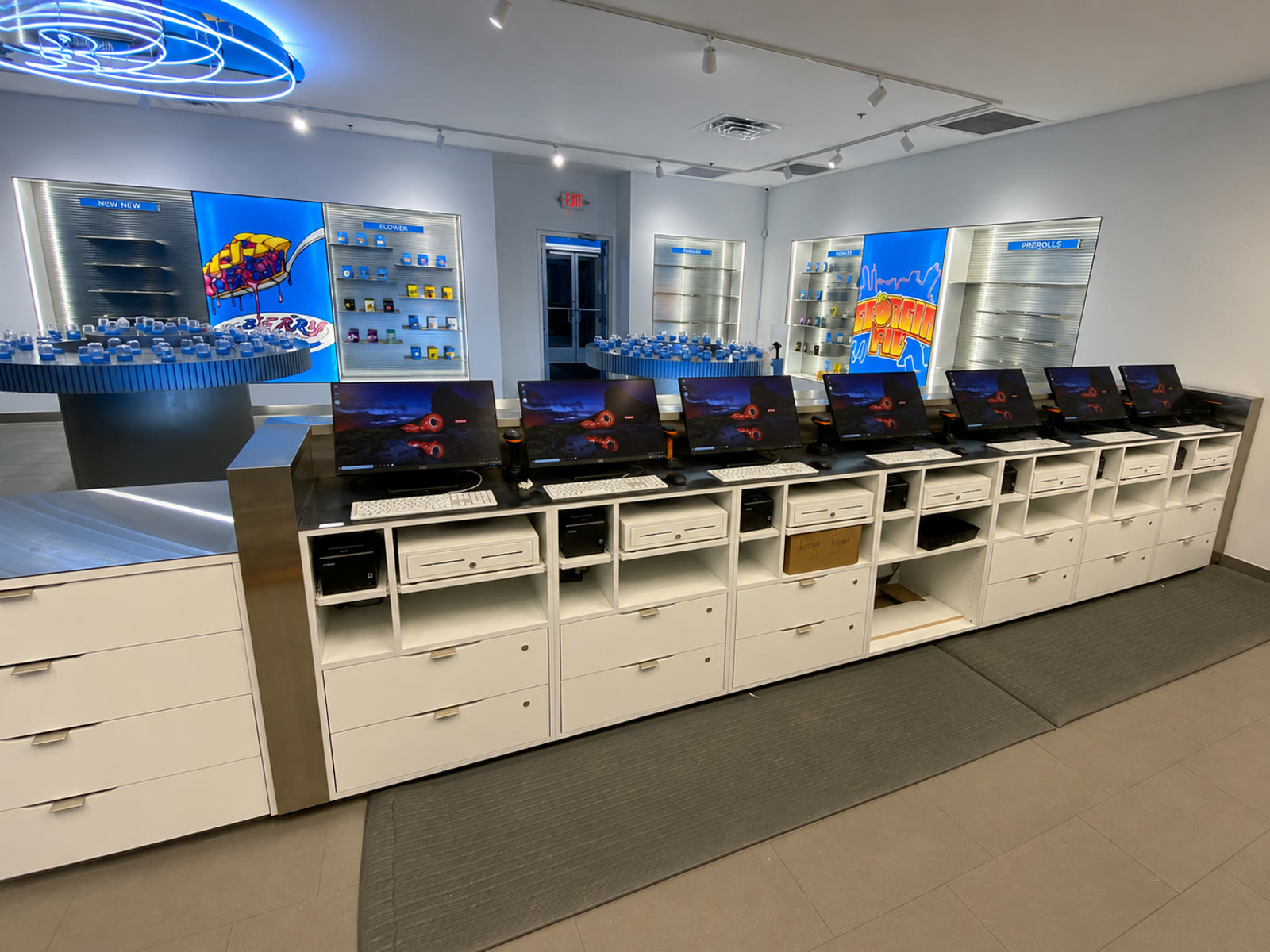 Finished retail store with a long row of point-of-sale workstations.